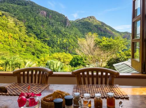 a table with a view of a mountain at Elegant Villa with Sea View in Victoria in Victoria