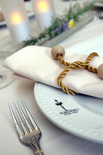 a table with a plate and a fork on it at La Posada Del Infante in La Puebla de los Infantes
