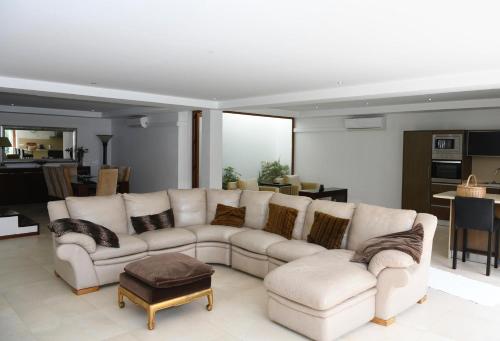 a living room with a white couch and a table at "Spacious villa in Caniçada with year-round private pool" in Caniçada
