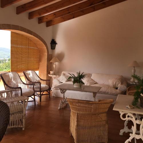 a living room with a couch and chairs and a table at Seaside villa in Jávea with private pool in Jávea