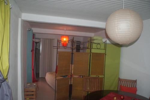 a room with a room with boxes and a lamp at Studio avec vue sur la mer à Fort-de-France 50 m² exceptionnel ! in Fort-de-France