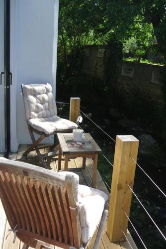 a porch with a chair and a coffee table at Picturesque Villa in Santo António das Areias with Private Pool in Marvão