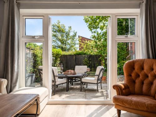 an open living room with a sliding glass door at Chilton Charm Modern 3BR Ideal for Long Stays in Chilton