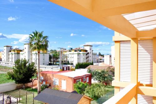 a view of a city from a balcony at Cozy apartment in Dénia, 40 m² with shared pool in Denia