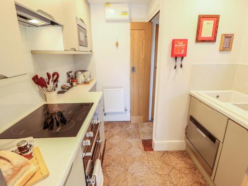 a kitchen with a sink and a counter top at Hangmans cottage in Horncastle