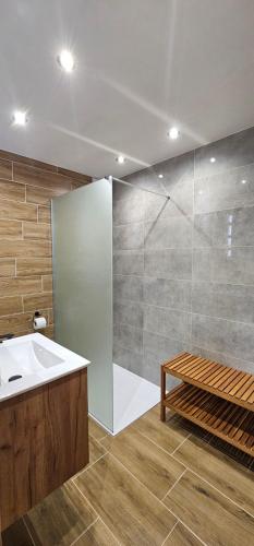 a bathroom with a white sink and a shower at Apartment Ulrich in Jablonec nad Jizerou