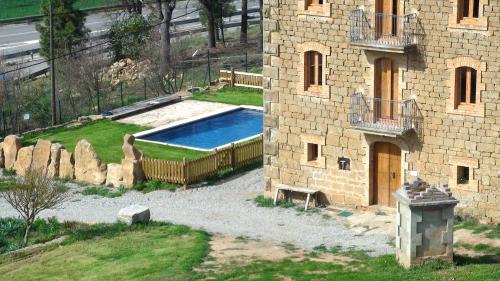 a building with a swimming pool in a yard at Charming Villa in Llobera with Private Pool in Llanera