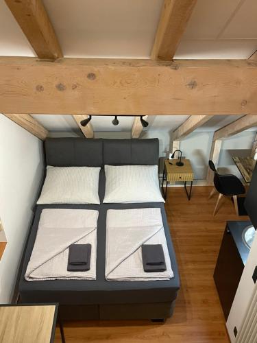a bedroom with a bed in a small room at Modernes und schönes Apartment VS in Villingen-Schwenningen