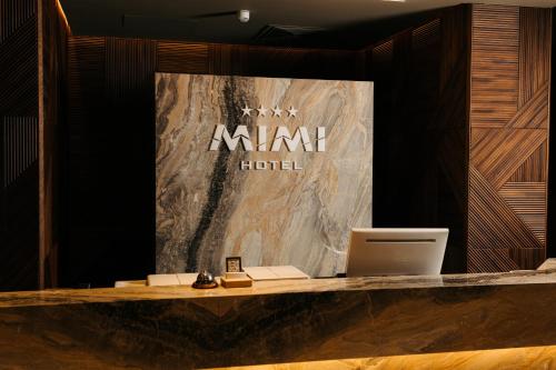 a lobby with a marriott hotel sign on a wall at Mimi Hotel Chisinau Jolly Alon in Chişinău