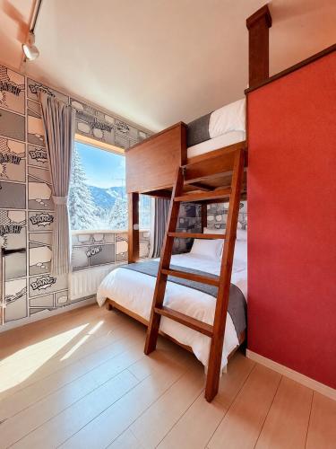 a bedroom with two bunk beds and a window at The Lobs 2, Rusutsu, Yotei view, 8 mins to Rusutsu in Kimobetsu