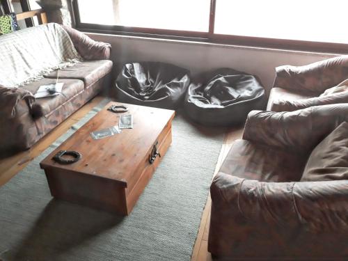 a living room with a couch and a coffee table at House with Shared Pool in Águeda, Mountain View in Urgueira