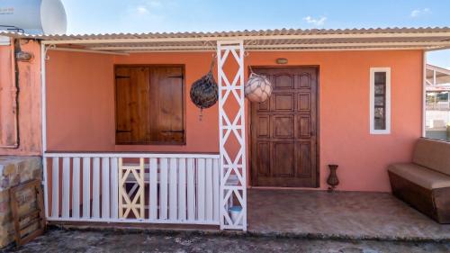 a house with a front door and a porch at Charming studio with sea-view terrace in Souillac - 22 m². in Souillac