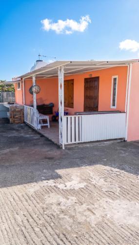 a house with an orange and white at Charming studio with sea-view terrace in Souillac - 22 m². in Souillac
