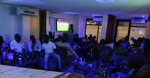 a group of people sitting in a room watching a presentation at Kalis Hotel in Douala