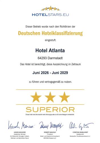 a flyer for a hotel with gold insignias at HOTEL ATLANTA Darmstadt SUPERIOR in Darmstadt
