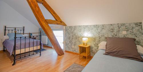a bedroom with two bunk beds and a bed sidx sidx sidx sidx sidx at Chez annie in Onjon