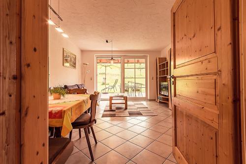 a dining room with a table in a room at Wiesenglück in Abtsgmünd