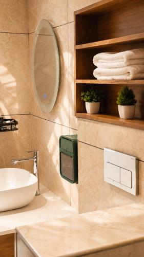 a bathroom with a sink and a mirror at Beachside Agatti Resort in Agatti