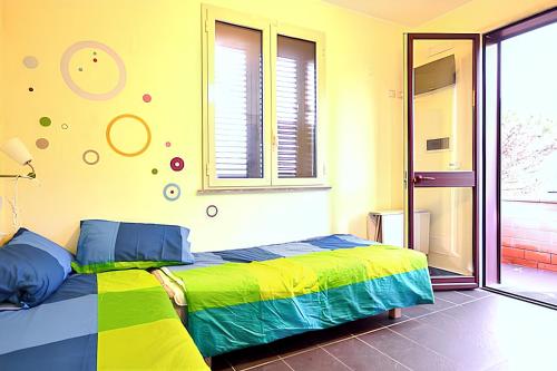 a bedroom with a bed and a window at Comfortable Studio in Nicolosi, 25 m² in Nicolosi