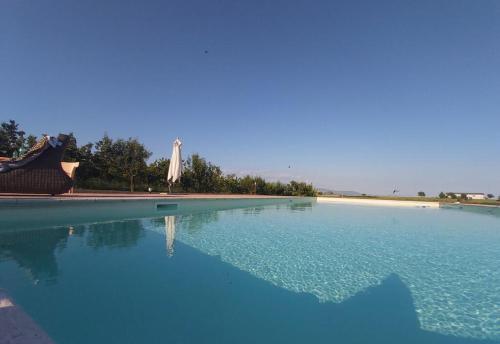 a swimming pool with blue water in a resort at Exquisite Retreat in Segni in Colleferro