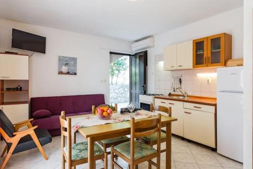 a kitchen and living room with a table and chairs at Charming Studio in Zavala - 25 m² - Parking Included in Zavala