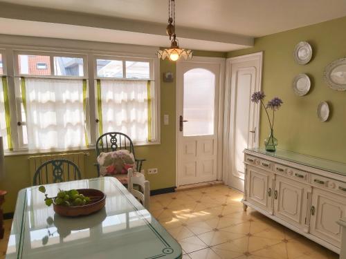 a kitchen with a table with a bowl of fruit on it at Spacious house with terrace and balcony in A Coruña in A Coruña
