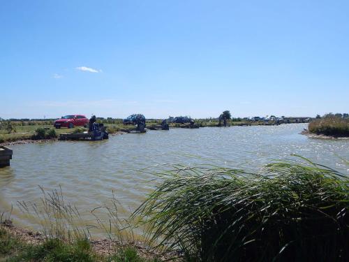 a view of a river with cars on it at George's Gaff - E4432 in Ingoldmells