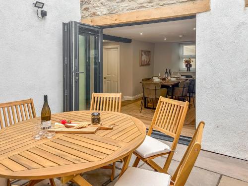 a wooden table with chairs and a dining room at Stone's Throw in Richmond