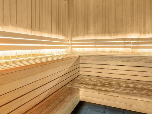 a empty sauna with wood paneled walls and benches at 178 Residences - Ukc8998 in Ilfracombe