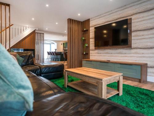 a living room with a couch and a coffee table at 12 Galloway - Ukc8975 in Warkworth
