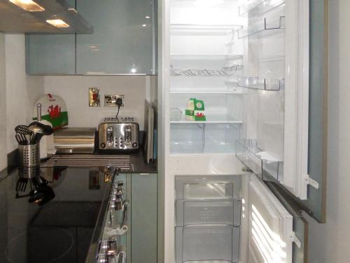 a refrigerator with its door open in a kitchen at Foxes Reach - Hw7421 in Trelleck
