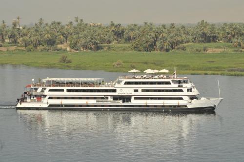 a large cruise ship on the water at M/Y Alexander The Great Nile Cruise - 4 Nights Every Monday From Luxor - 3 Nights Every Friday from Aswan in Luxor
