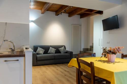 a living room with a couch and a table at La Stella del Borgo in Castelmezzano