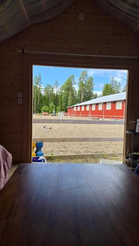 a view of a barn from the inside of a barn door at Pikku aitta in Heikkilä