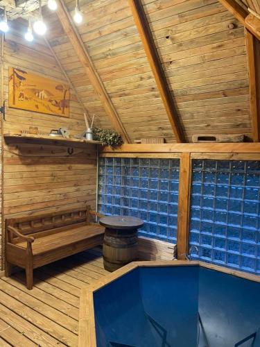 an empty sauna with a tub in a wooden cabin at Садиба у Оксани in Verkhneye Sinevidnoye