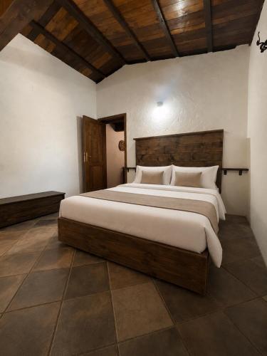 a bedroom with a large bed in a room at Casa La Liccia in Calangianus