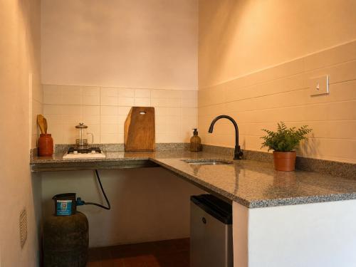 a kitchen with a sink and a counter top at Vivir en Maimará in Maimará