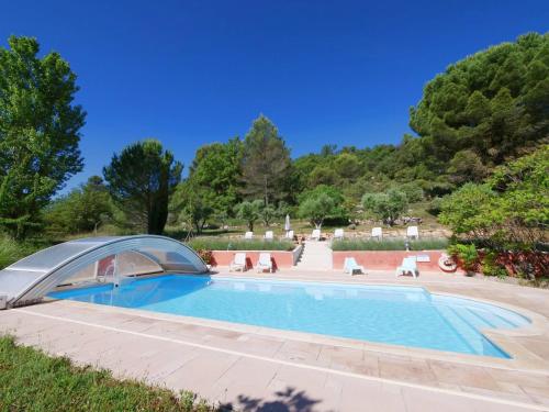 a swimming pool with a tent around it at Campagne SAINT MAURINET in Montmeyan