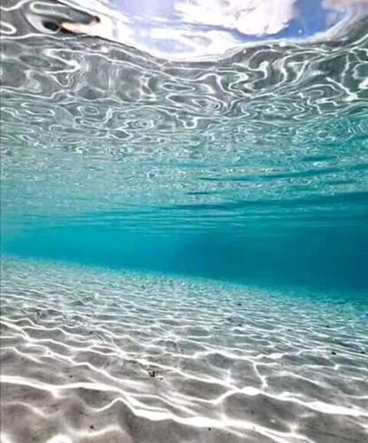 a close up of the ocean water at Vacances El Haouaria in El Haouaria