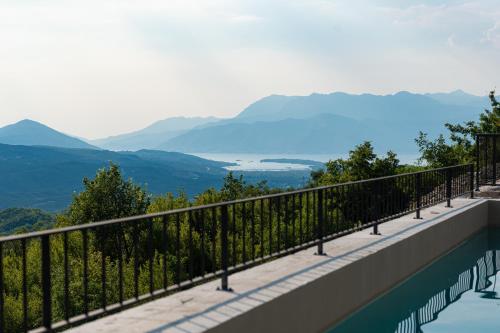 a swimming pool with a view of mountains at Villa Verdura in Budva