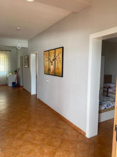 a living room with a painting on the wall at Marina View in Shëngjin