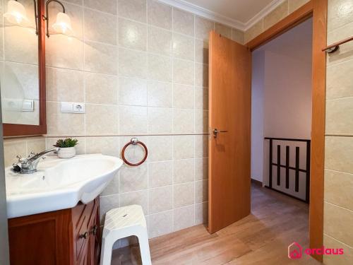 a bathroom with a sink and a mirror at Bloom House in Oropesa del Mar