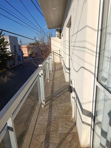 a hallway of a white building with a window at Concordia, Entre Rios in Concordia
