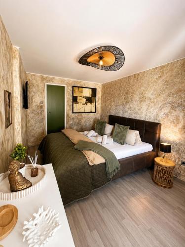 a bedroom with a large bed in a room at Apartmány KRAKENS in Šumperk