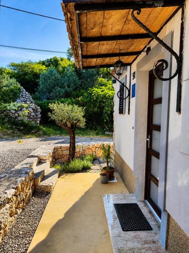 an entrance to a building with a door at Holiday home Brseč in Mošćenička Draga