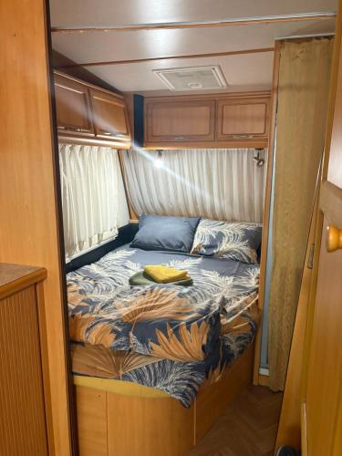 a small bed in the back of an rv at Divoto Zove in Tsarevo