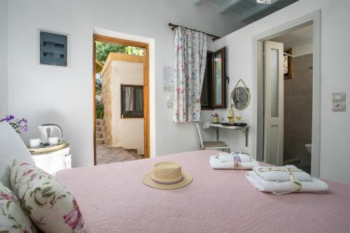 a room with a pink table with towels on it at Medieval Inn in Rhodes Town