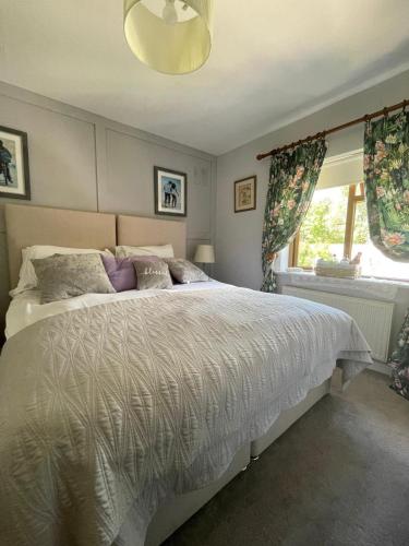 a bedroom with a large bed and a window at Magic of Mullingar in Mullingar