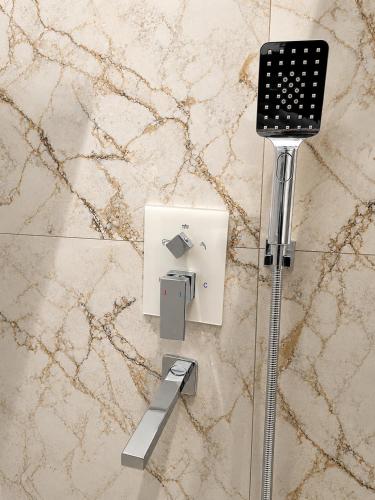 a plugged in electrical outlet on a marble floor at Mia Bella Madre Morogoro in Morogoro