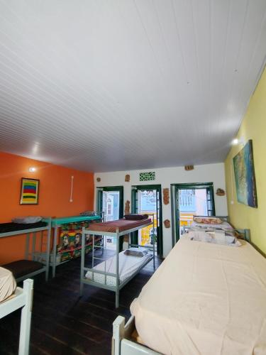 a bedroom with a bed and a desk in it at Casaraosete7 in Salvador